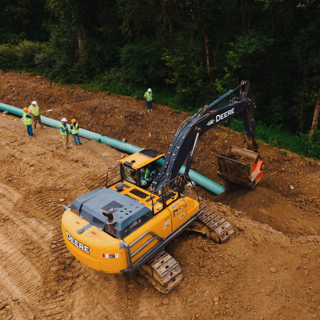 ALLU screening bucket mounted on a John Deere 300g excavator padding a pipeline in West Virginia.